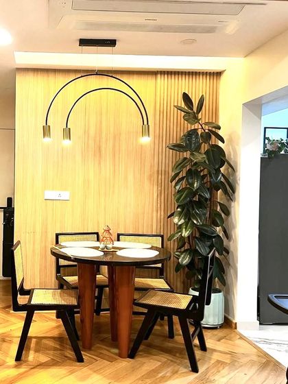A Ficus Elastica, or rubber plant, is a perfect statement piece for a dining area. Its tall, elegant form and dark, glossy leaves add a touch of modern sophistication while improving indoor air quality.