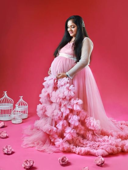 Another beautiful shot from the fairytale studio session. The long, voluminous train of the pink ruffled gown is the star of the show.