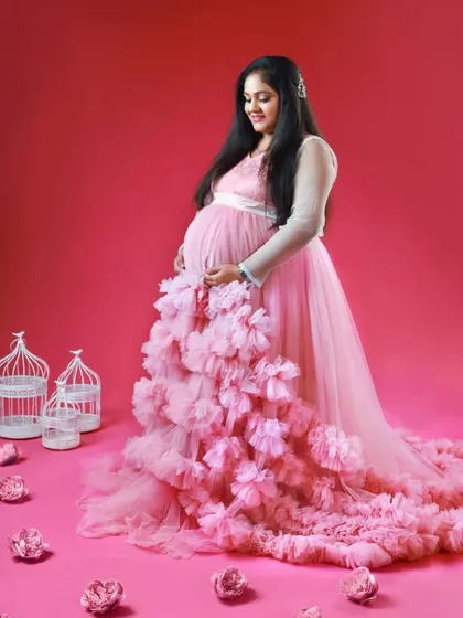 Another beautiful shot from the fairytale studio session. The long, voluminous train of the pink ruffled gown is the star of the show.