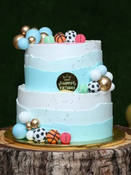 The sports ball cake on display at a beautifully decorated party.