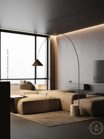 This sleek, arched floor lamp provides targeted lighting with a minimalist footprint. Its elegant curve extends over sofas or reading chairs, offering a functional and stylish solution for modern living rooms and studies.