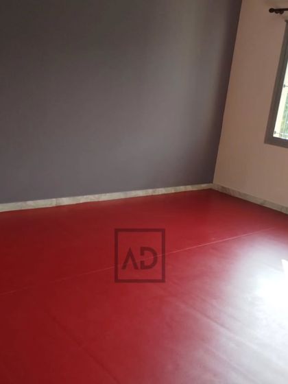 The finished room with the 6mm red sports flooring. It transforms a regular room into a dedicated space for fitness, dance, or sports practice.