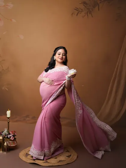 Celebrating heritage and motherhood. We believe in creating portraits that are deeply personal. This expectant mother is beautifully styled in a traditional pink saree, blending cultural elegance with the timeless joy of pregnancy for a truly meaningful photograph.