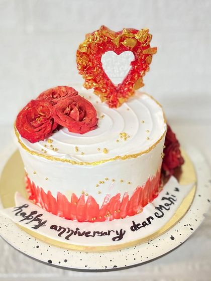 From our love series, a beautiful vanilla anniversary cake with an isomalt heart and fresh roses.