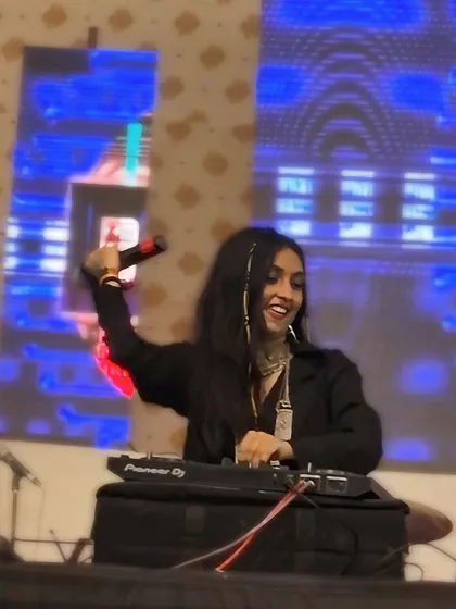Another shot from the 'Watch me shine' series at a private event in Navsari. The smile and mic in hand show how much I enjoy these intimate gigs.