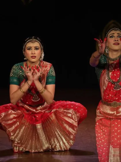 A duet performance, showing the synchronization and interaction between two dancers. My expression of surprise and wonder is a key part of the storytelling.