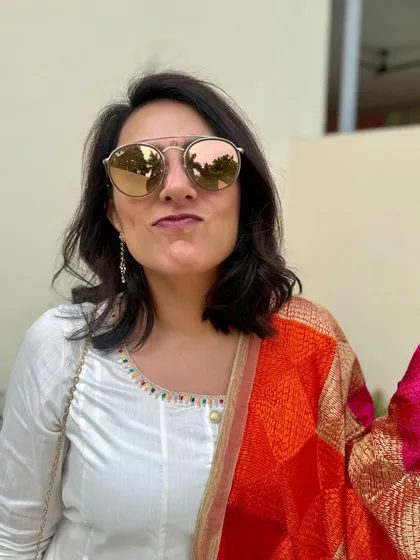 Just twirling in a beautiful phulkari dupatta I bought in Amritsar. A colorful dupatta can instantly elevate a simple white anarkali.