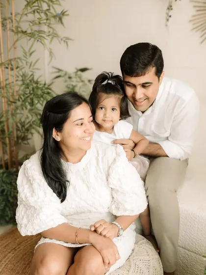 A classic family-of-three portrait, full of warmth and happiness.