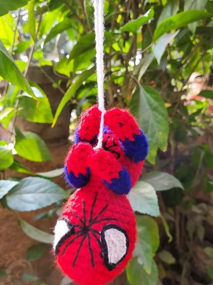Another angle of our hanging Spider-Man toy, showing the detailed stitch work on his mask and suit. It's a fun and unique piece for any superhero fan.