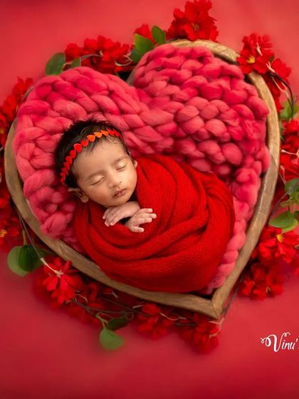 This overhead view of the red heart theme shows the baby perfectly centered, creating a powerful symbol of love. The floral border completes the heart shape beautifully.