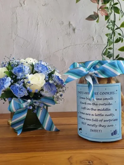 A beautiful pairing of a blue and white floral arrangement with a jar of our "Dads are like cookies" biscotti. A sweet and thoughtful Father's Day gift.