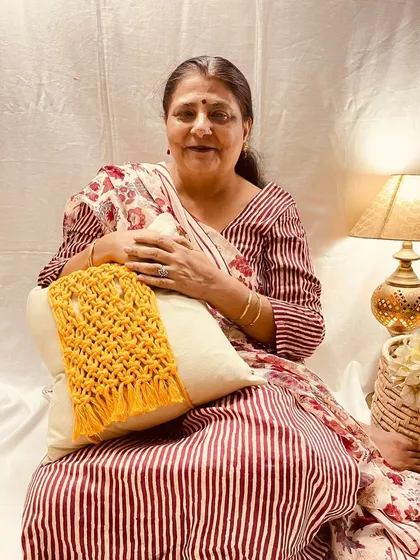 Here I am with one of my macrame cushion tie-backs. It’s a simple way to add a bit of texture and personality to a plain cushion. I love how this mustard yellow piece brings a pop of color and a cozy, handcrafted feel to the room.