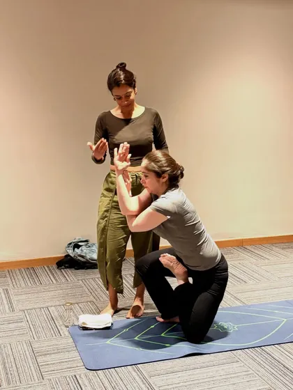 A closer look at the hand and arm alignment in Vatayanasana. These small, precise adjustments help protect the joints and deepen the student's understanding of the posture's mechanics.