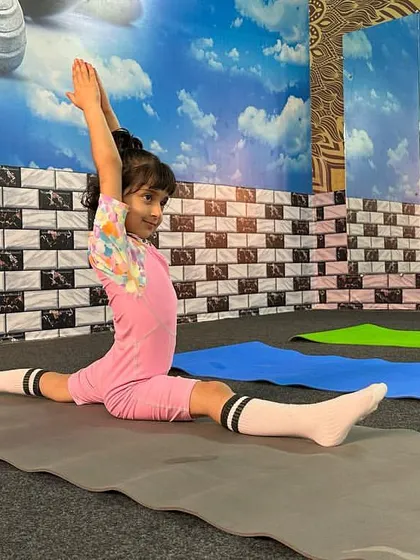Here is one of my students demonstrating her flexibility at a local yoga competition. We encourage our students to participate in various events to build their confidence.