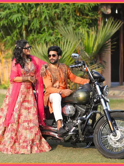 Starting the Mehendi moments with a roar. The couple makes a grand entry on a motorcycle, setting a cool and edgy tone for the celebration.