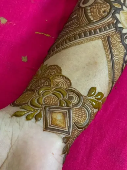 A beautiful wrist cuff design with a geometric center and leafy vines, perfect as a standalone piece or part of a larger design.