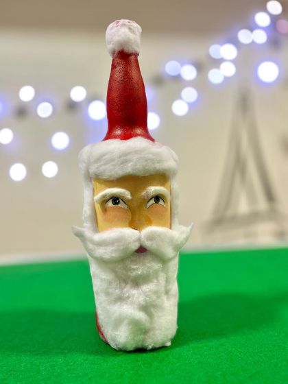Getting into the Christmas spirit with some bottle art. I transformed a simple glass bottle into this cheerful Santa Claus, perfect for holiday decor.
