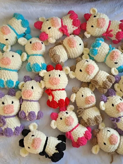 A whole herd of my mini cow plushies! These can be made into keychains or left as small toys, and they are perfect for a farm-themed party.