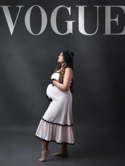 A high-fashion moment. We love creating editorial-style portraits, like this "Vogue" inspired shot. The classic dress and bold typography create a chic and timeless image.