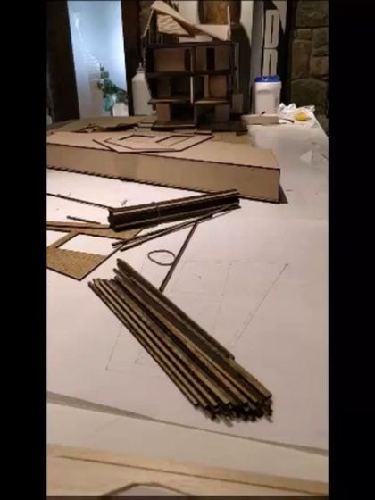 The components of the Brick House architectural model, laid out before assembly. This deconstruction shows how we think about architecture as a system of parts.