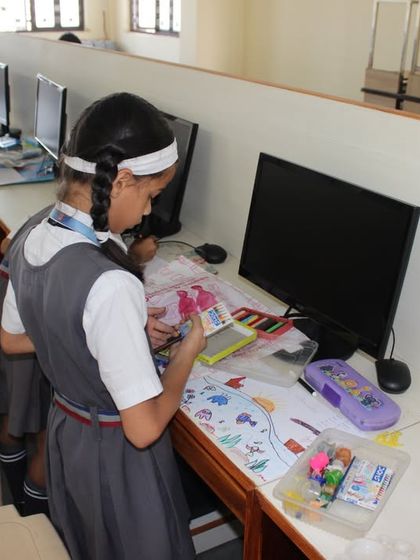 Students participating in the 2023 Olympiad at St. Clare’s School Unit II, using the computer lab for their creative entries.
