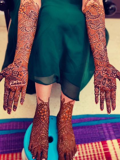 The full bridal mehndi for this lovely bride, including detailed work on her hands and feet.