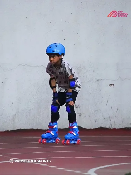 Focus and determination on wheels. This young skater is fully equipped with safety gear, concentrating on his posture and glide during a practice session on our Nerul track.