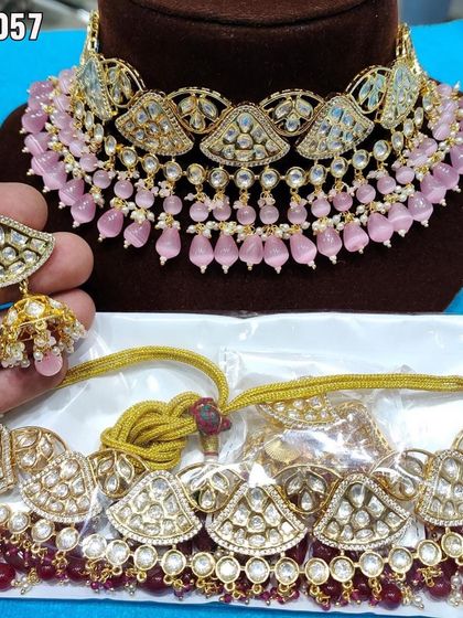 Two variations of a pink kundan choker, one with meenakari work and the other with ruby accents.