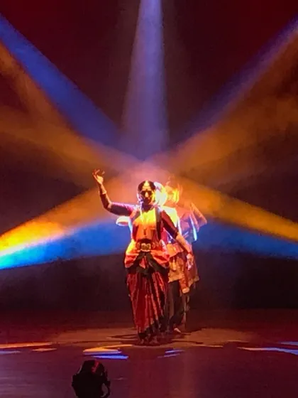 Another powerful image from 'Akhandalaya'. The use of haze and focused lighting creates a mystical atmosphere, highlighting the dancer's silhouette and expressive gestures.