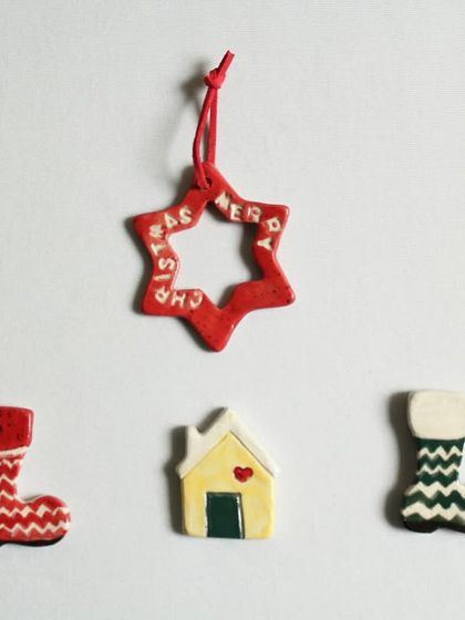 A collection of my festive magnets and ornaments, including stockings, a little house, and a star. These make wonderful small gifts or stocking stuffers.