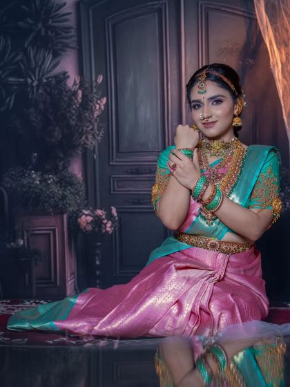 This full seated view captures the grace of the pose and the complete bridal look with our rental jewellery.