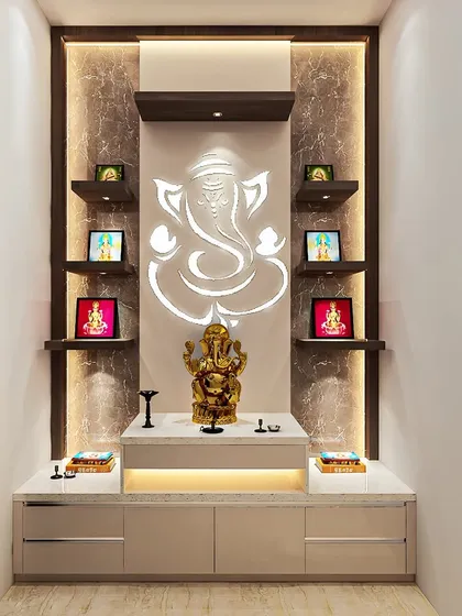We created this modern pooja mandir with a backlit Ganesha motif as the centerpiece. The design includes floating shelves for idols and a sleek base cabinet for storage, all illuminated with warm, ambient lighting.