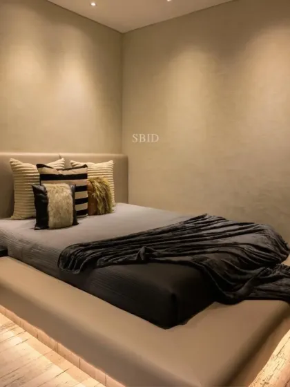 The large, low-platform bed in the teen's room is perfect for chilling with friends. The under-bed lighting adds a moody, modern touch to the space.