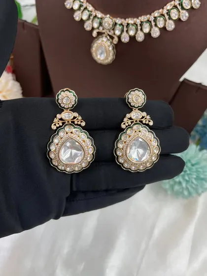 The 'Amaya' earrings with green meenakari.