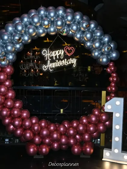 Celebrating a first anniversary is pure magic. For this special occasion, I created a statement balloon ring in chrome silver and ruby, with a "Happy Anniversary" neon sign and a light-up marquee number '1' to mark the beautiful milestone.
