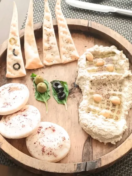 Our Mediterranean platter is a fresh and healthy option for any event. It features creamy, homemade hummus served with a variety of soft pita bread, lavash crackers, and olives.