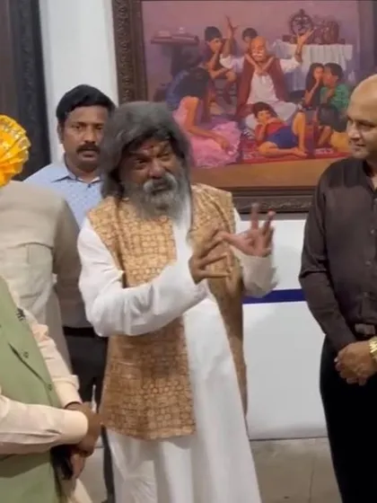 The late, great art director Shri Nitin Desai explaining a painting at an exhibition he organized at his world-famous ND Film Studio, where I was an invited artist.