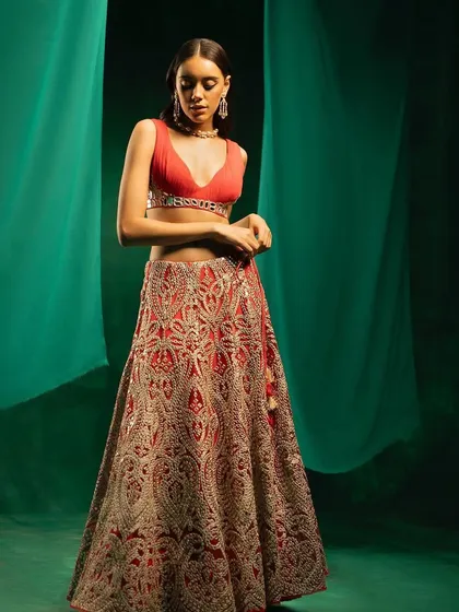 A full-length shot of the red mirror-work lehenga by 29 India.