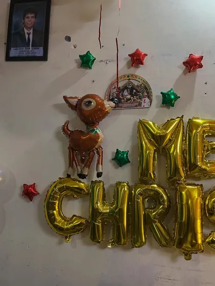 A cute reindeer foil balloon, adding to the holiday theme.