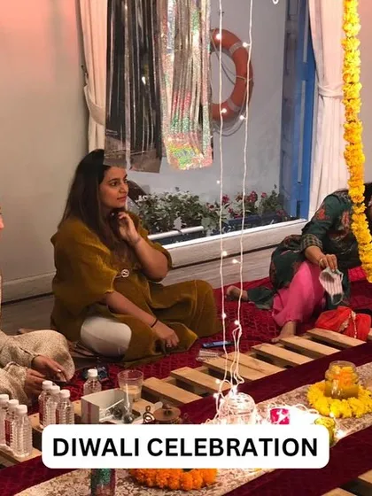 A candid shot of guests enjoying our Diwali celebration. We create a comfortable and festive environment for you to relax with your loved ones.
