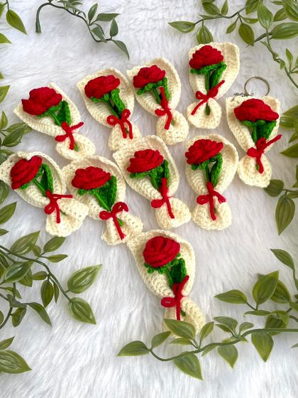 A set of mini red rose bouquet keychains. The classic red rose in a tiny, portable form.