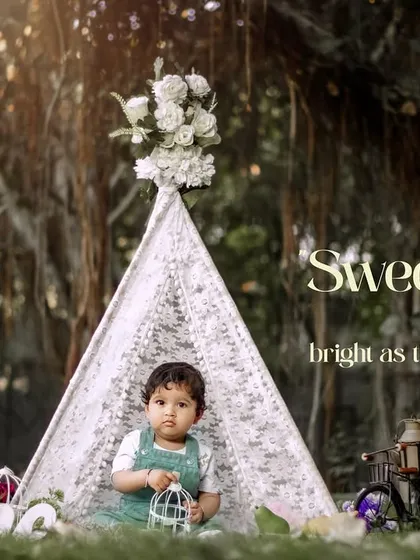 Sweet as candy, bright as the sun. This little boy holds a birdcage prop while sitting in our outdoor teepee setup for his first birthday.