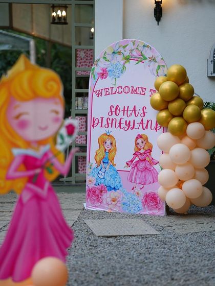 The welcome area for "Soha's Disneyland," featuring cutouts of Princess Aurora and Cinderella, setting the stage for a royal celebration.