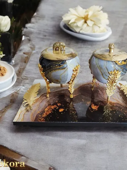 This elegant serving set features two marble-patterned jars with decorative elephant lids, resting on a matching tray. It is designed as a luxurious dry fruit box or decorative container, making it an ideal high-end gift for special occasions.