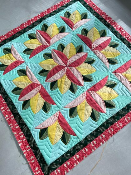 A "Big Bloom" wall quilt with stunning 3D folded fabric flowers.