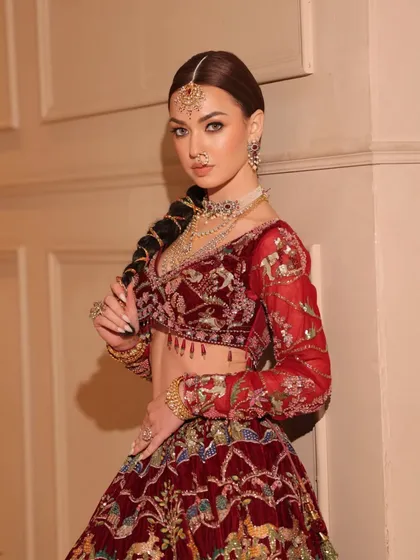 A modern take on the traditional red bridal look. I styled this velvet lehenga with layered diamond and polki jewelry for a touch of contemporary glamour.