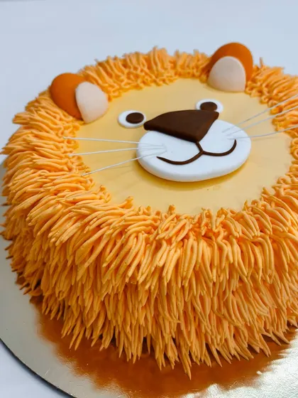 Is it cute, fierce, or delicious? This lion cake is all three. The buttercream mane gives it a fun, furry texture.