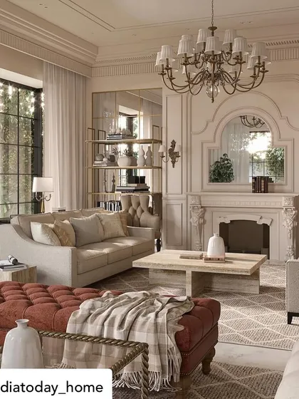 Featured in India Today Home, this living room from "The Colonial House" project showcases a blend of European influences. A deep red ottoman adds a bold touch of color to the otherwise neutral space, centered around a classic fireplace.