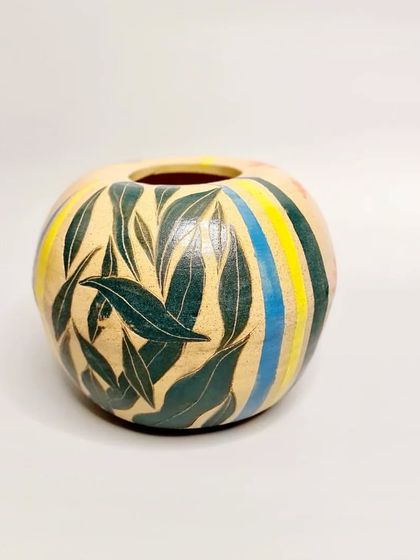 Another one of my pieces for the Clay in Common community project. This one features a sgraffito leaf design with colorful stripes.