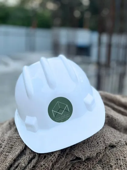 An identical shot of our branded hard hat. It represents our professionalism and the full ownership I take from start to finish.